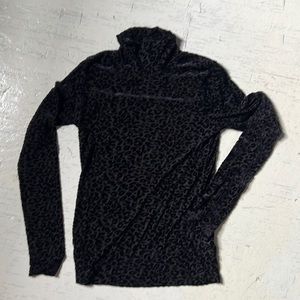 Semi-sheer black velvet leopard turtleneck